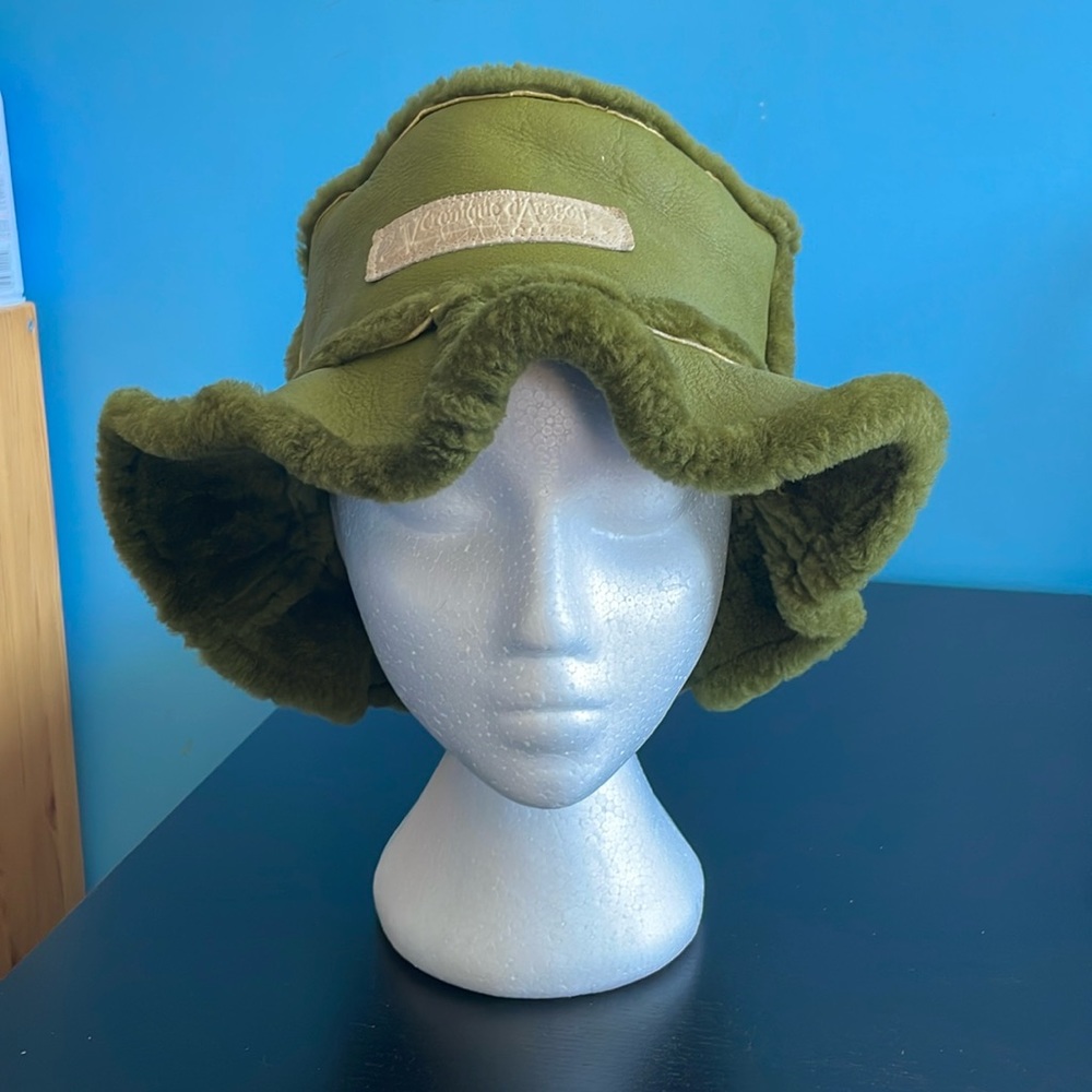Veronique d’Aragon lamb skin hat. Purchased at the one of a kind show.  Green